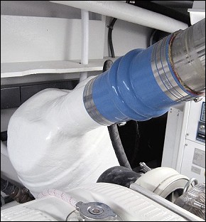 Close-up of the Starboard riser/wet mixer to muffler connection. - Because of the short hose, a "double hump" was used for added flexibility and safety"