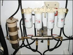 A simple and low restriction manifold system using large full-flow valves and 1/2" ID lines for a 2 x 300 HP engines and 1 x 30 Kw gen set that was done by the owner with a touch of guidance